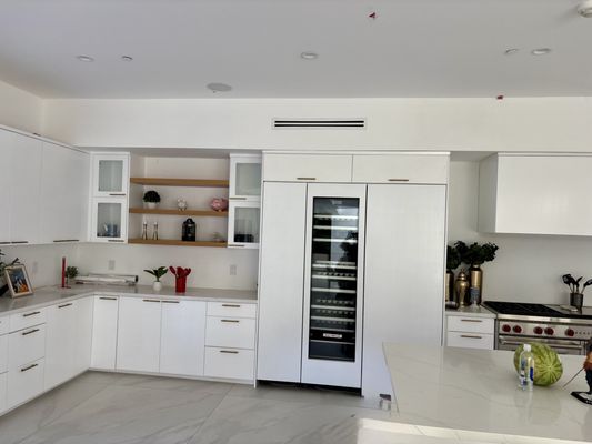 Panel-ready wine cooler built into custom cabinetry
